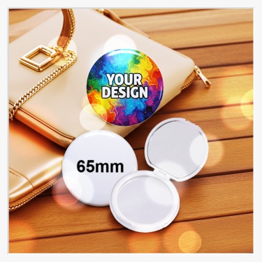 65mm Klappspiegel aufgeklappt vor einer Handtasche